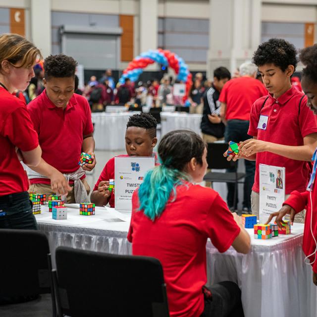 2019 Festival attendees play with Rubik's Cubes