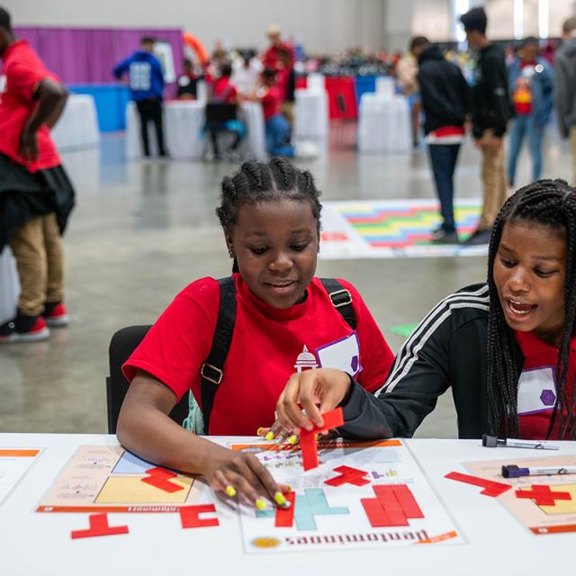 2019 Festival attendees focused on shape puzzles