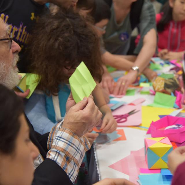 Math inspects paper at Origami Station - National Math Festival 2019