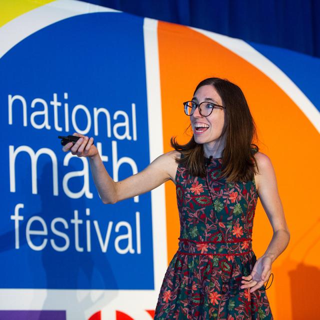 Festival Presenter Annie Raymond presenting on stage - National Math Festival 2019
