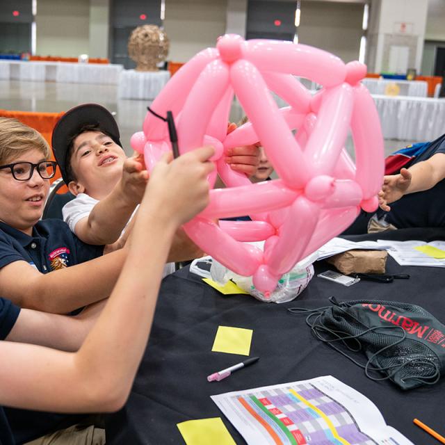 2019 festival attendees with geometric balloon sculpture