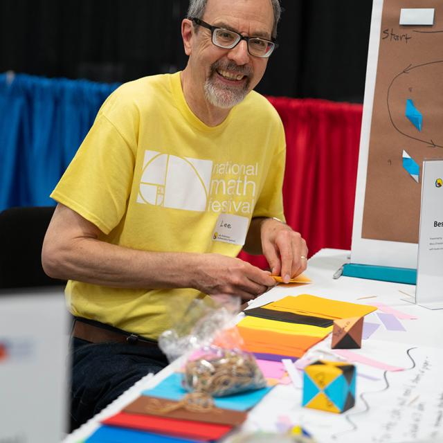 2019 Festival volunteer doing origami